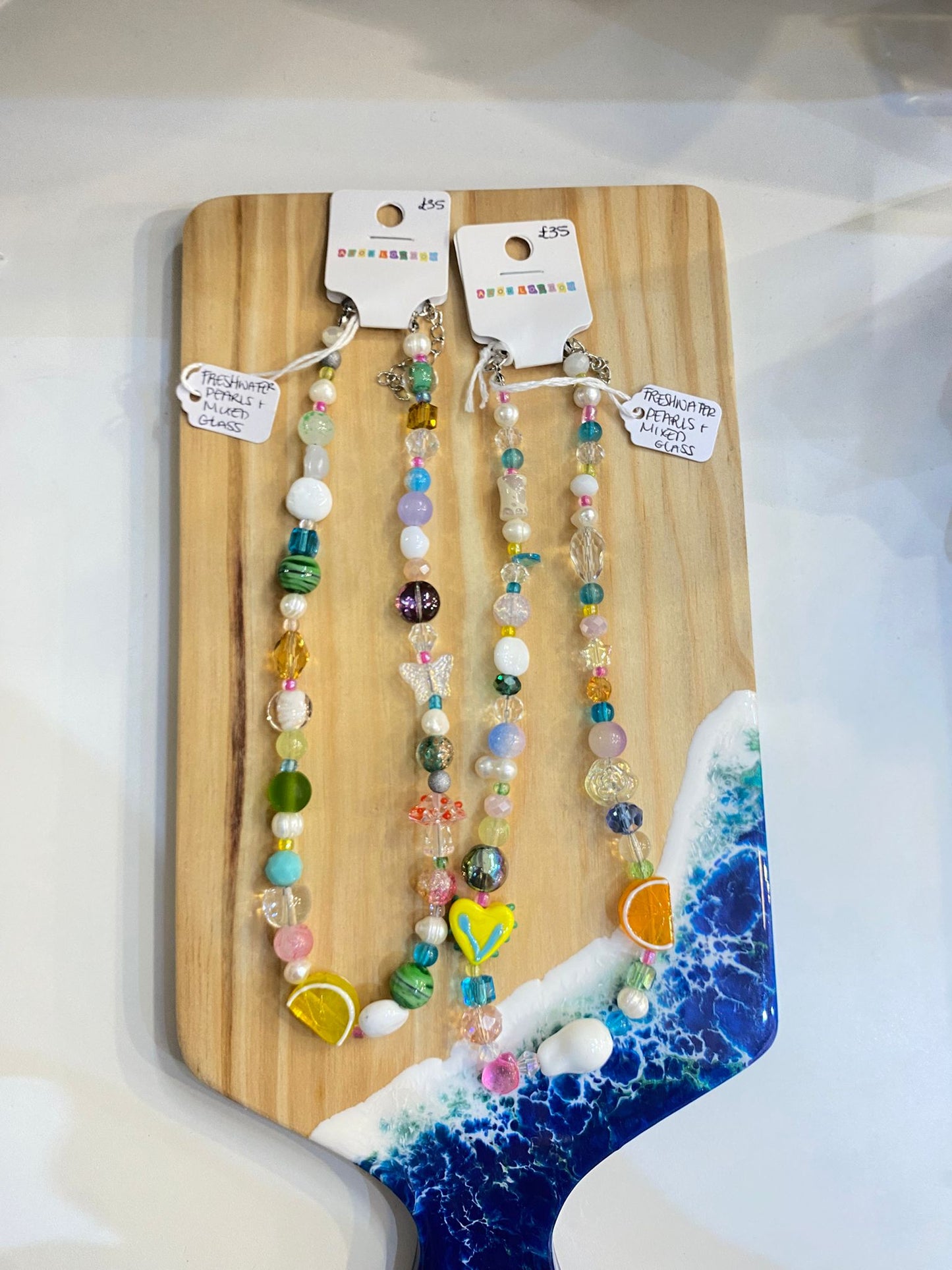 Colourful and quirky mismatched mixed glass and freshwater pearl necklace with lemon or orange bead